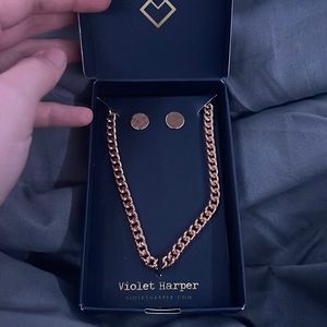 gold necklace and earring